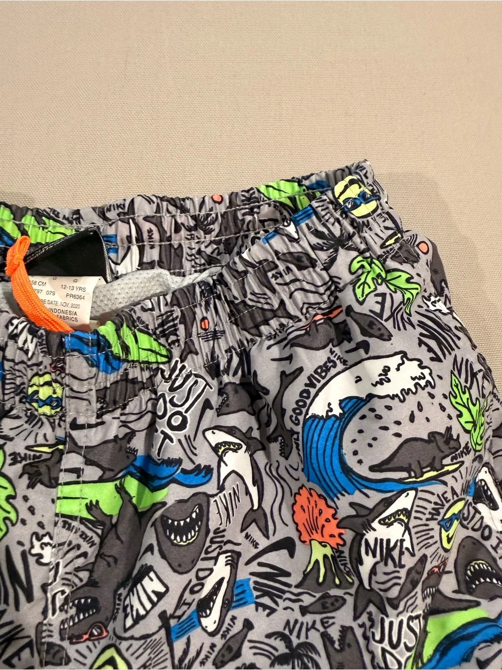 Nike Kids Gray Swim Trunks with Bright Graphic Print